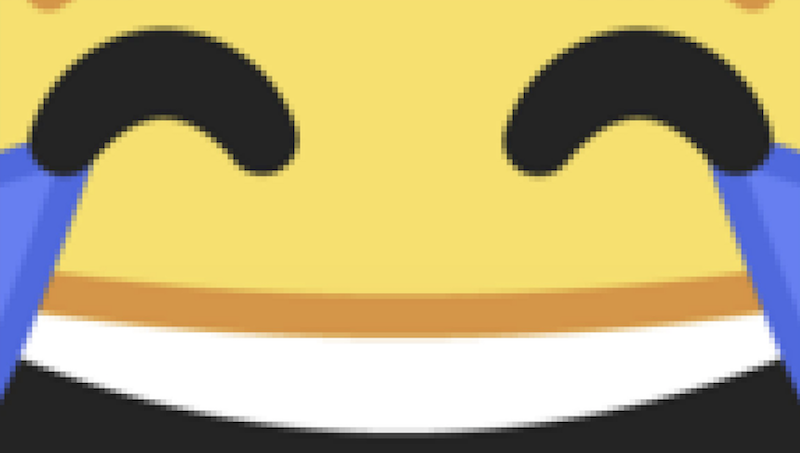zoomed-in emoji of laughing tears of joy with squares of pixels distinguishable