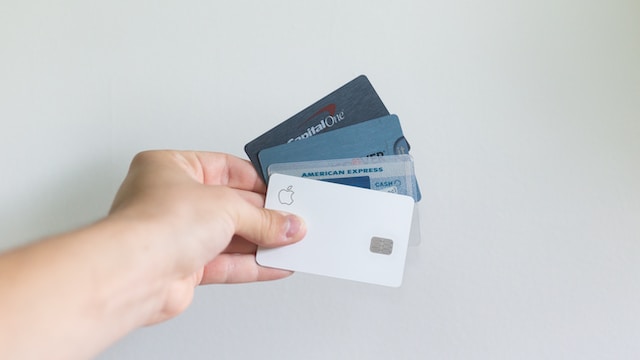 Person holding credit cards